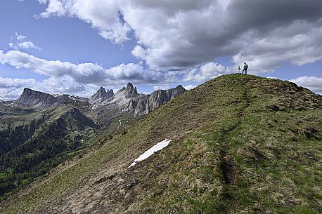 Hiker on the top of Col de la Puina mount towards the Lastoni di Formin, Croda da Lago and the Becco di Mezzod mountains, dolomites, Veneto, Italy, Europe