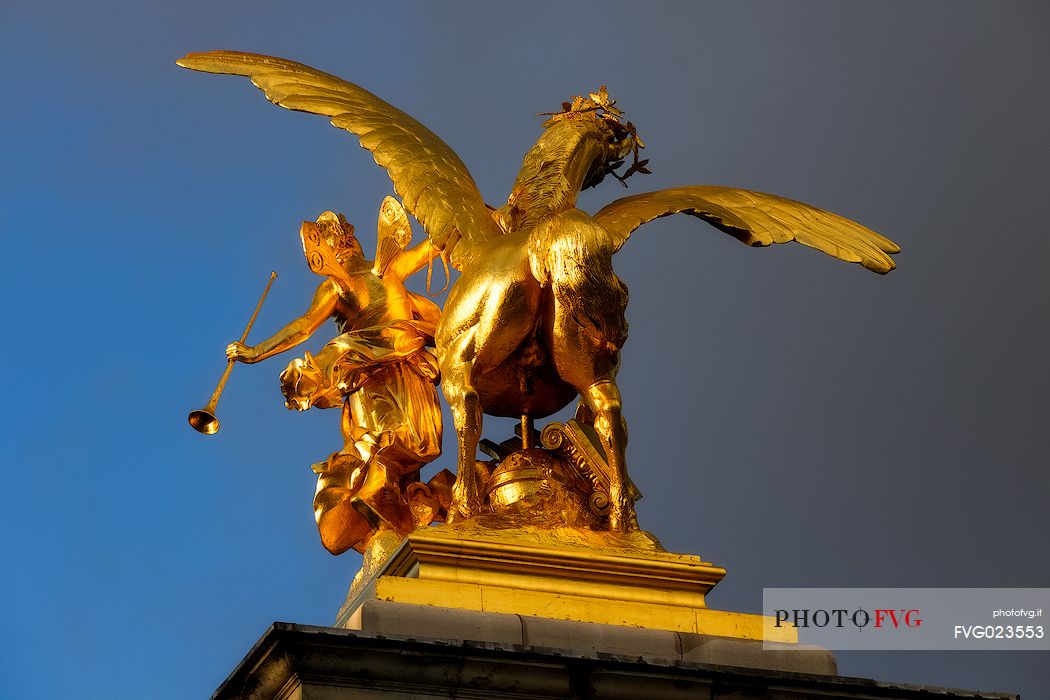 Golden horse statue at Alexander III Bridge. Paris, France