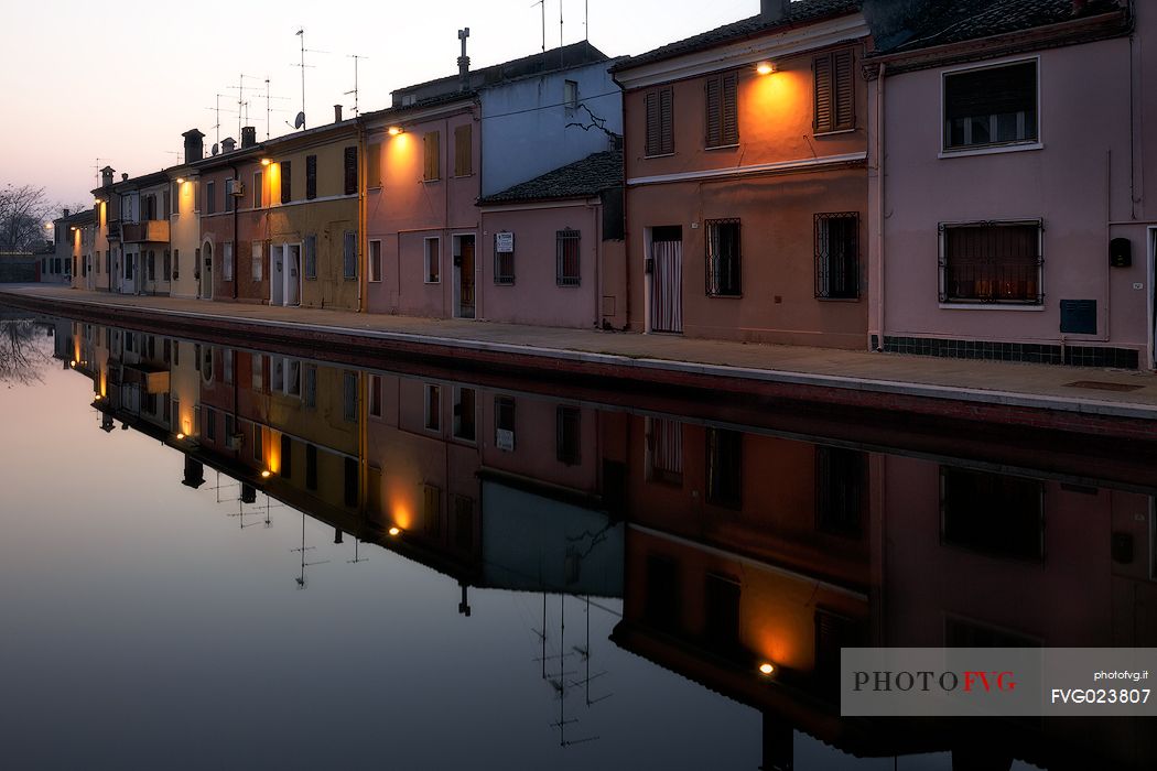 Houses along the canals at twilight, Comacchio, Italy