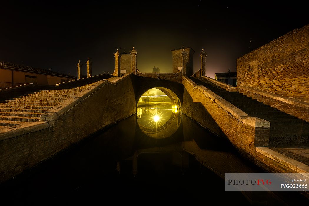 Triple bridge, Ponte dei Trepponti, called Ponte Pallotta (1638 Luca Danese architect), famous bridge landmark of town of Comacchio