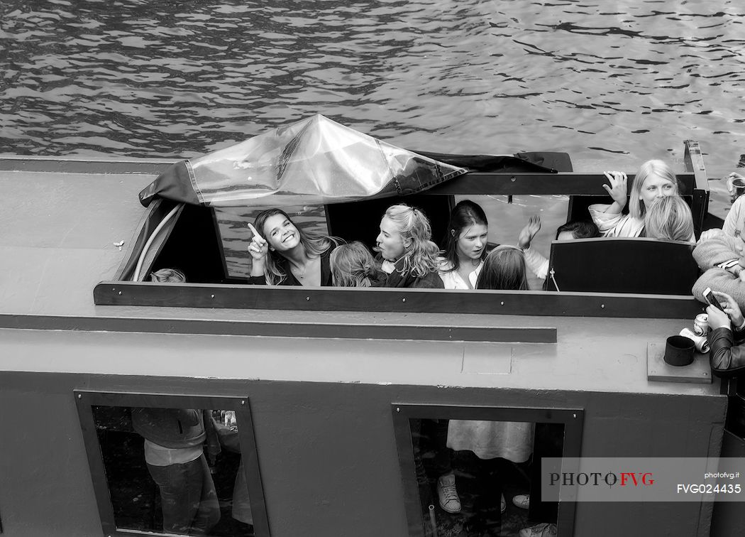 It's saturday and the dutch youth make a party along the Amsterdam canals.Just for fun.Dutch lifestyle. Holland