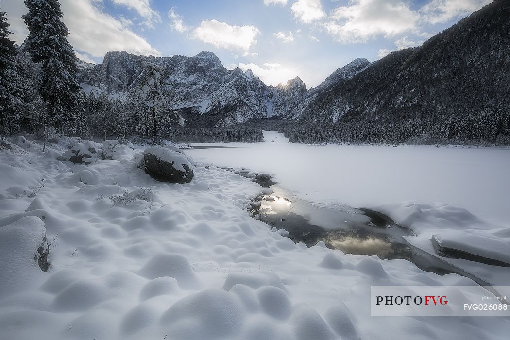 Fusine lake and Marngart mountain range in winter, Julian alps, Italy