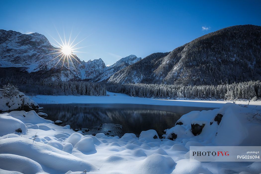 Fusine lake and Marngart mountain range in winter, Julian alps, Italy