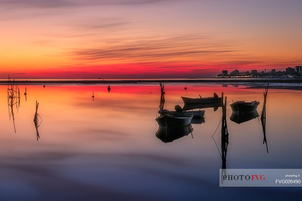 Boats in the red sunset, Grado, Italy