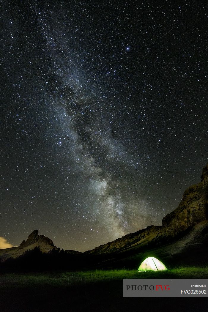 Milky way and starry night campground, Federa Lake, Cortina d'Ampezzo, dolomites, Italy