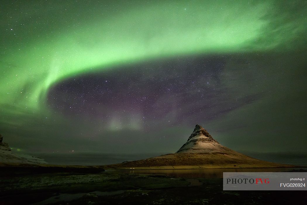 Aurora borealis ring around Kirkjufell mountain, Iceland