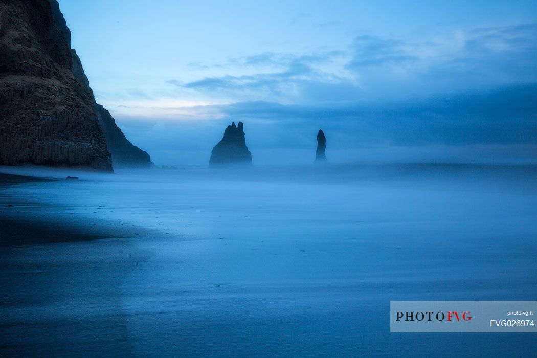 Volcanic rock formations at the sunset, Vik beach, Iceland