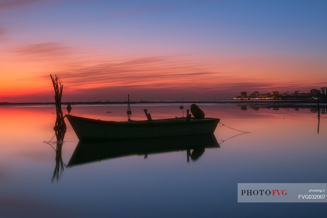 Boat docked on the shore of Grado Pineta, Adriatic sea, Friuli Venezia Giulia, Italy