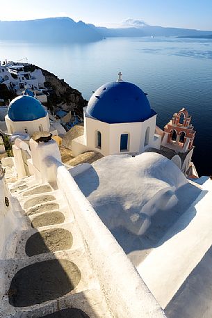 The blue dome is a typical cult building of cyclades islands, Oia, Santorini, Greece