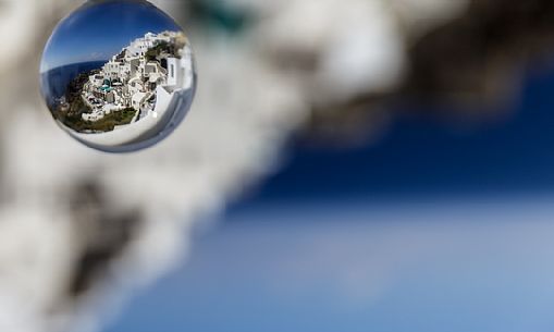 A piece of Santorini Island into a crystal ball, Greece