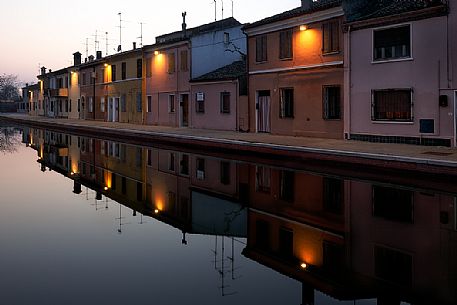 Houses along the canals at twilight, Comacchio, Italy