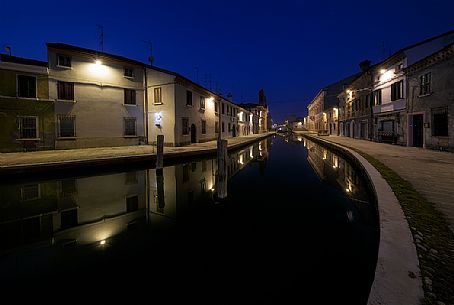 Houses along the canals at twilight, Comacchio, Italy