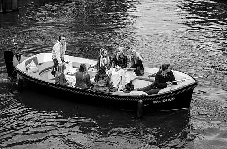 It's saturday and the dutch youth make a party along the Amsterdam canals.Just for fun.Dutch lifestyle, Holland It's saturday and the dutch youth make a party along the Amsterdam canals.Just for fun.Dutch lifestyle, Holland