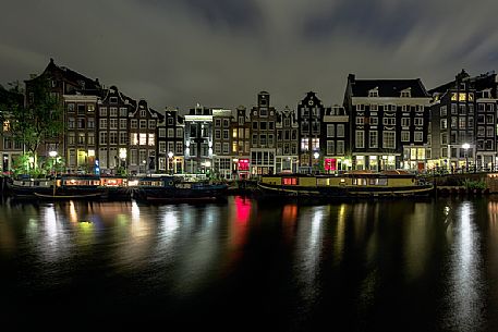 Amsterdam Canal House and boat house (floating house) in Amsterdam, Holland Amsterdam Canal House and boat house (floating house) in Amsterdam, Holland
