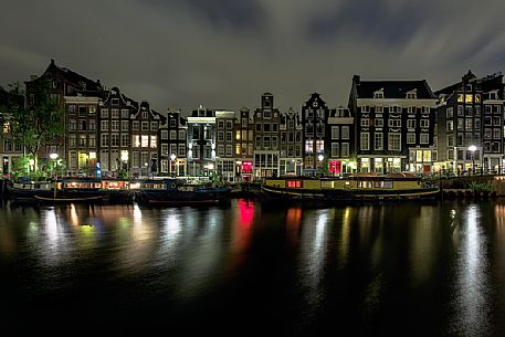 Amsterdam Canal House and boat house (floating house) in Amsterdam, Holland