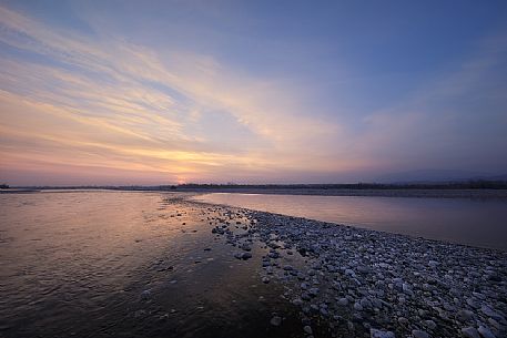 Sunset on Talgliamento river, Italy