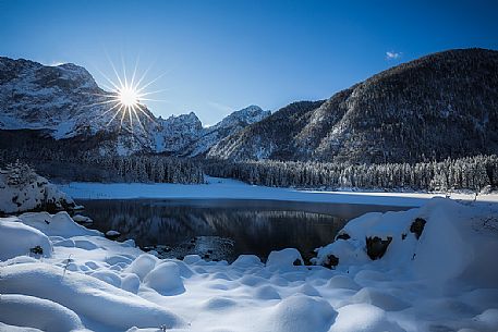 Fusine lake and Marngart mountain range in winter, Julian alps, Italy