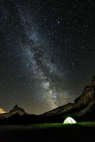 Milky way and starry night campground, Federa Lake, Cortina d'Ampezzo, dolomites, Italy