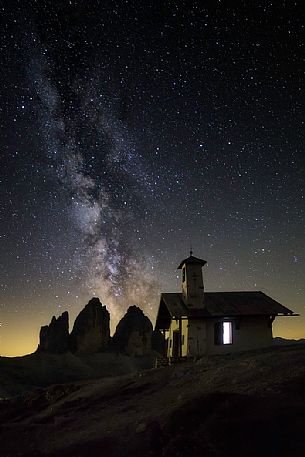 Milky way over the Tre Cime di Lavaredo peaks, dolomites, Italy