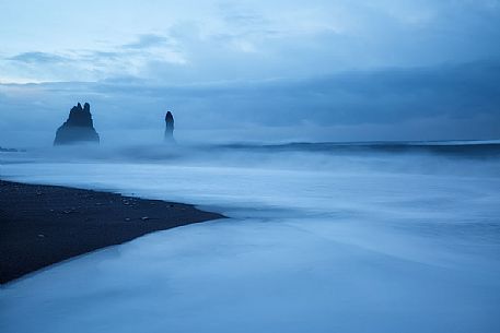 Volcanic rock formations at the sunset, Vik beach, Iceland