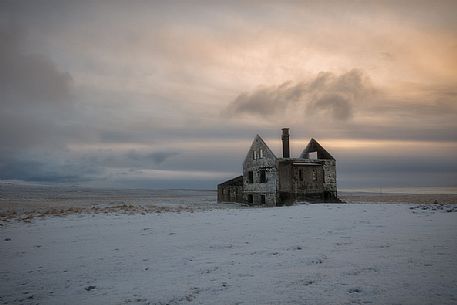 Sunrise in the house ruins at Londrangar coast, Iceland