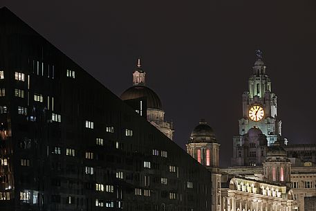 Cityscape from Albert docks at night, in the background the Three Graces and the Royal Liver Building, Liverpool, United kingdom Cityscape from Albert docks at night, in the background the Three Graces and the Royal Liver Building, Liverpool, United kingdom