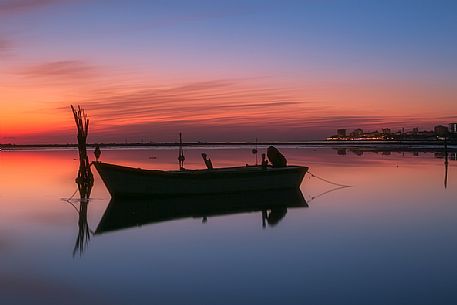 Boat docked on the shore of Grado Pineta, Adriatic sea, Friuli Venezia Giulia, Italy