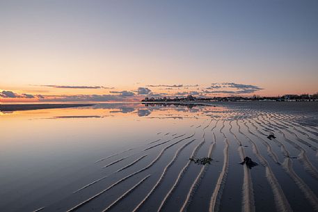 Shoreline reflections in Grado Island at sunset, Friuli Venezia Giulia, Italy Shoreline reflections in Grado Island at sunset, Friuli Venezia Giulia, Italy