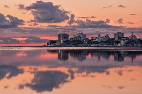 Shoreline golden reflections in Grado lagoon at sunset, Friuli Venezia Giulia, Italy