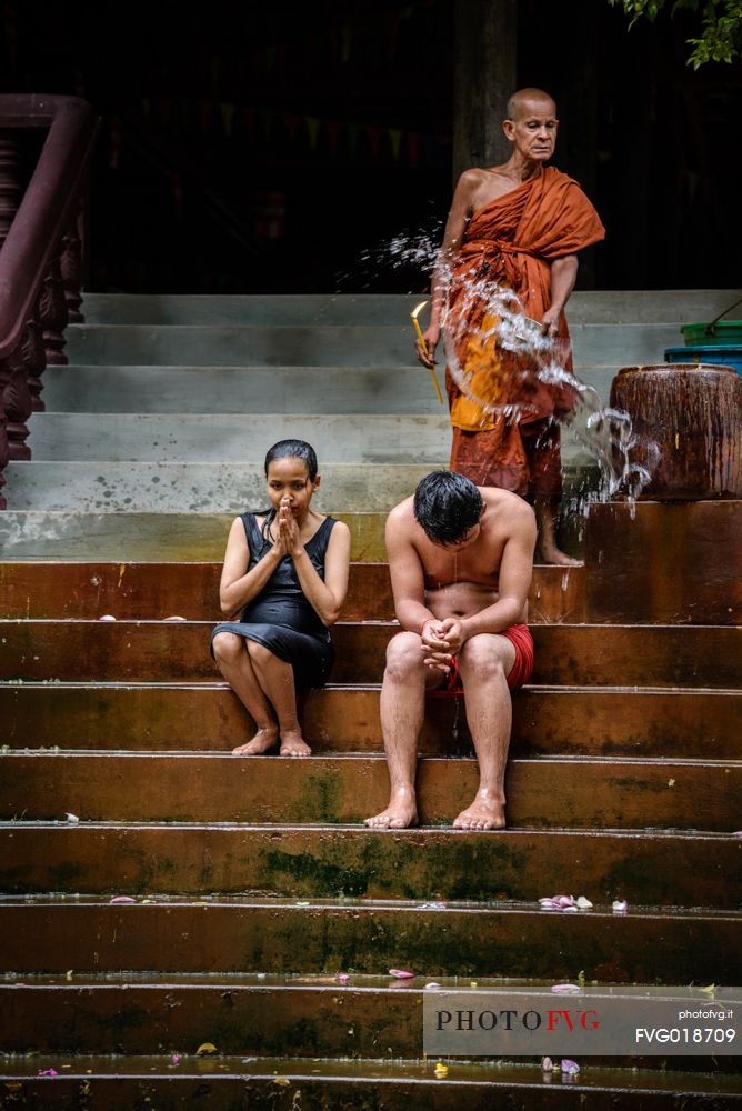 Buddhist monk blesses people