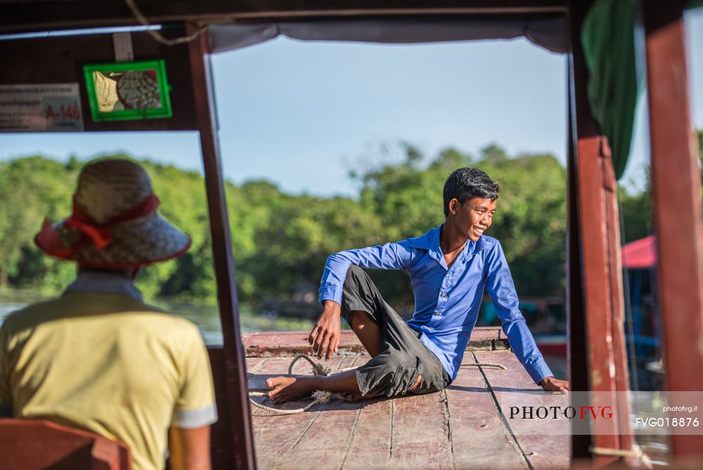 Young boy on a boat to Kompong Pluk