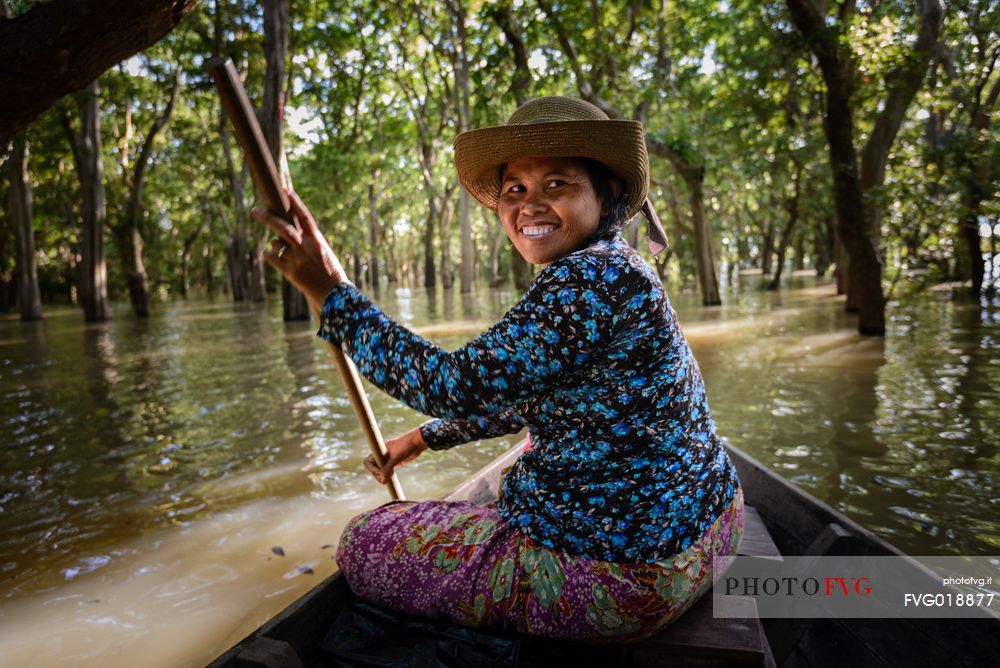 Woman on a boat at Kompong Pluk