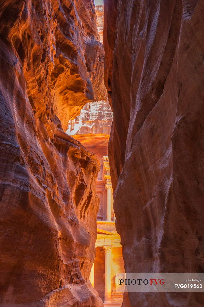 Light in the ancient city Petra through the narrow canyon, Jordan