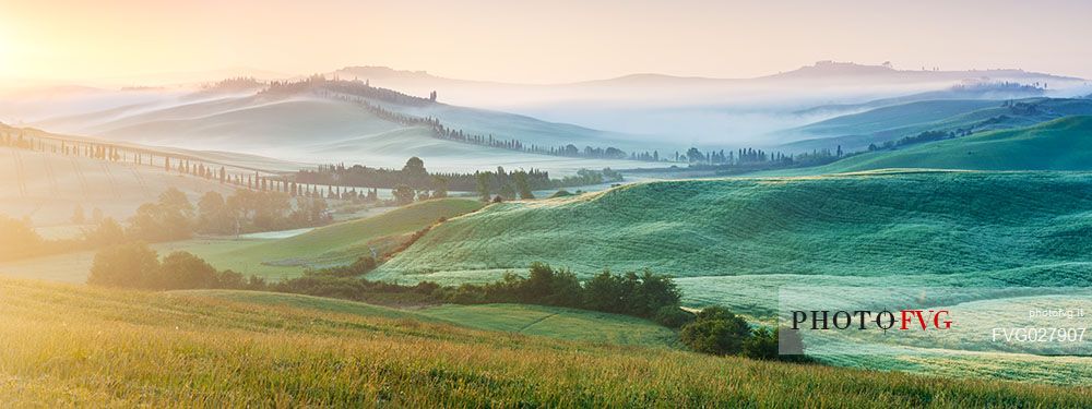 Crete Senesi landscape at sunrise, Orcia valley, Tuscany, Italy