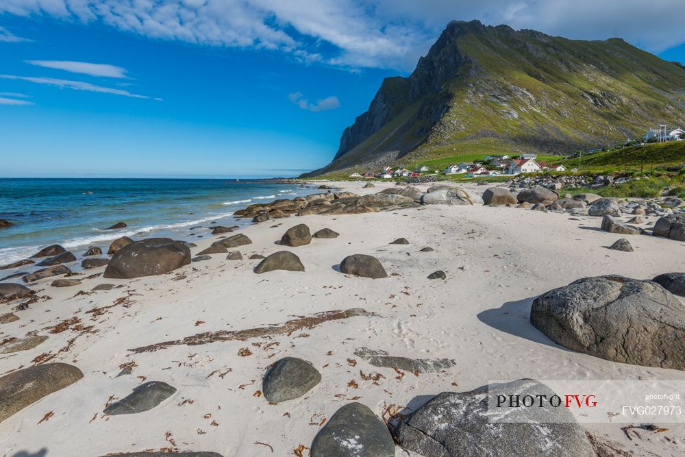 Norwegian beach with the remote coastal village of Vikten, Lofoten Islands, Norway