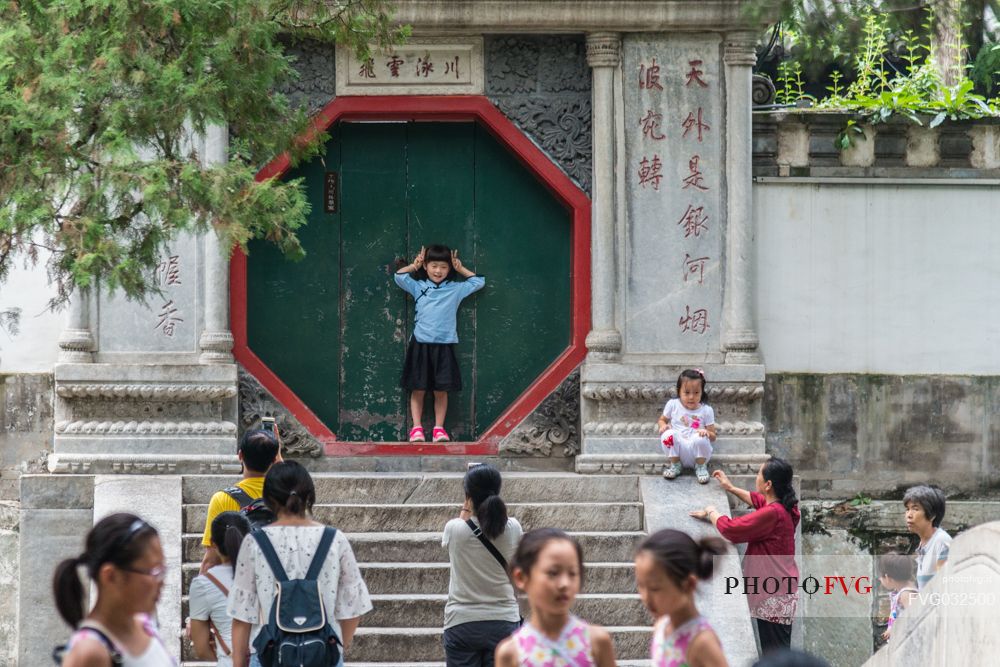 Tourists at the Beihai Park, the imperial garden to the north-west of the Forbidden City in Beijing, China