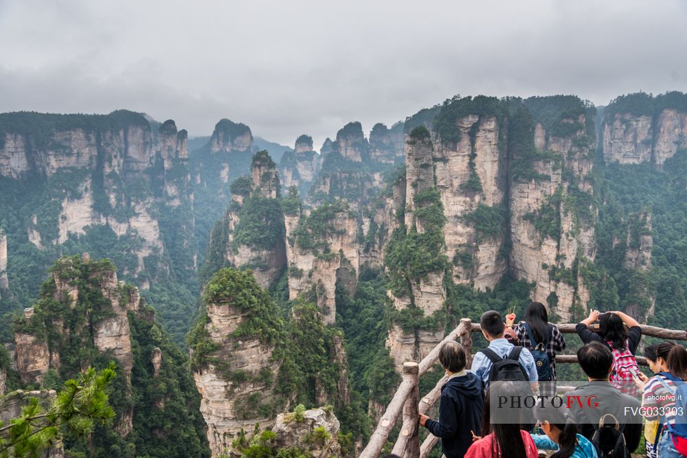 Tourists admiring the Hallelujah mountains or Avatar mountains in the Zhangjiajie National Forest Park, Hunan, China