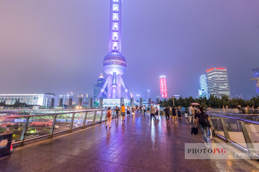 Lifestyle in Shanghai city, in the background the Oriental Pearl Tower  lighting, Shanghai, China