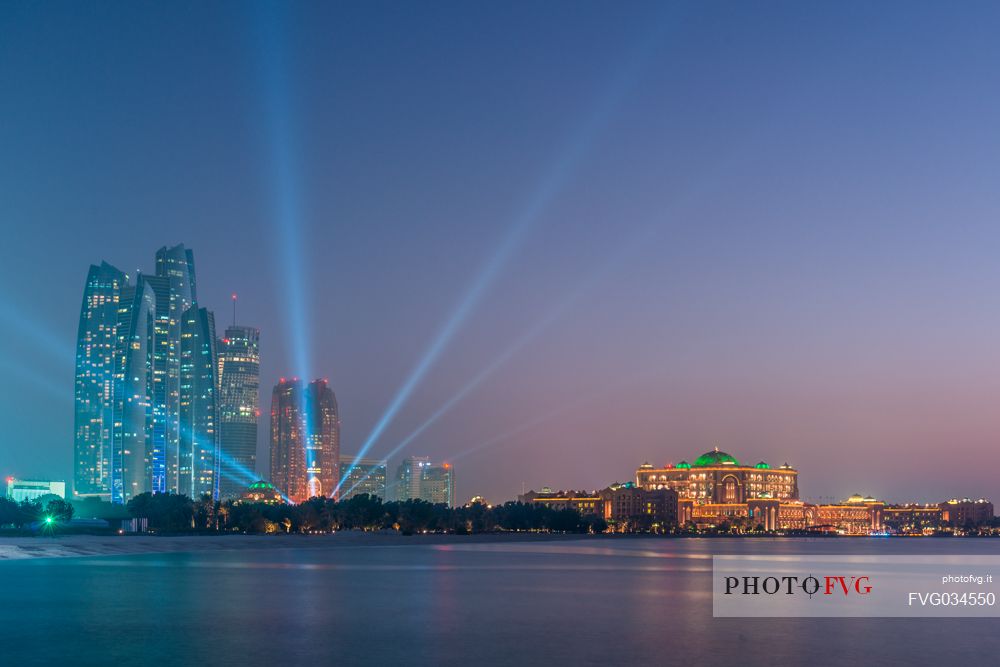 Night view of Etihad Towers, Bab al Qasr and Kempinski Emirates Palace Hotels on the Corniche in the City of Abu Dhabi, Emirate of Abu Dhabi, United Arab Emirates, UAE