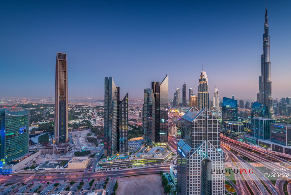 Burj Khalifa and High Rises on Sheikh Zayed Road at twilight, Downtown Dubai, Emirate of Dubai, UAE, Asia