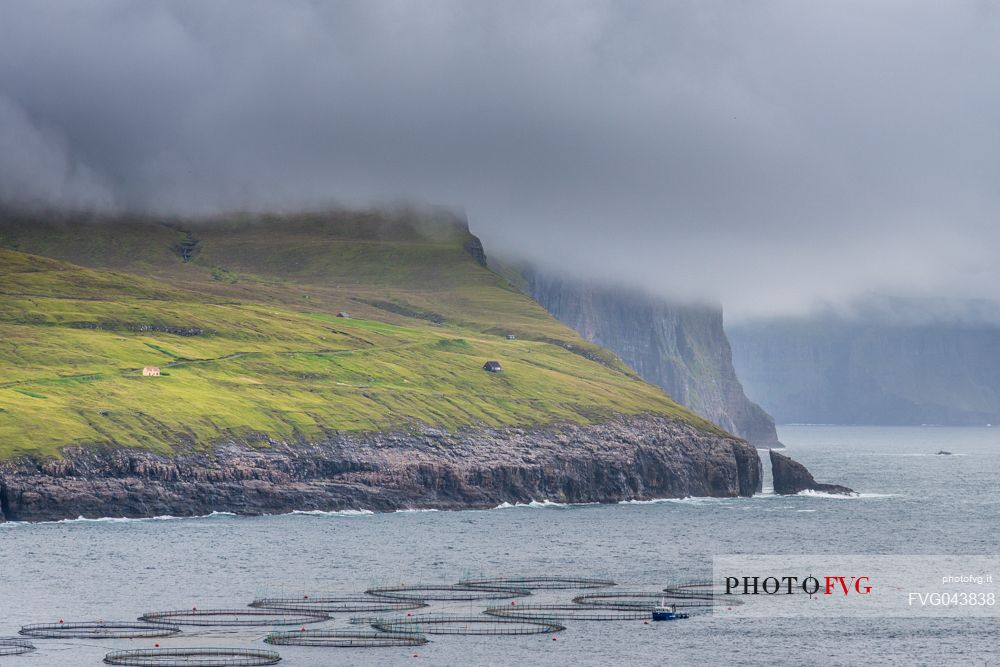 View of Trllkonufingur with fish farming, Vagar island, Faroe Islands, Denmark, Europe
