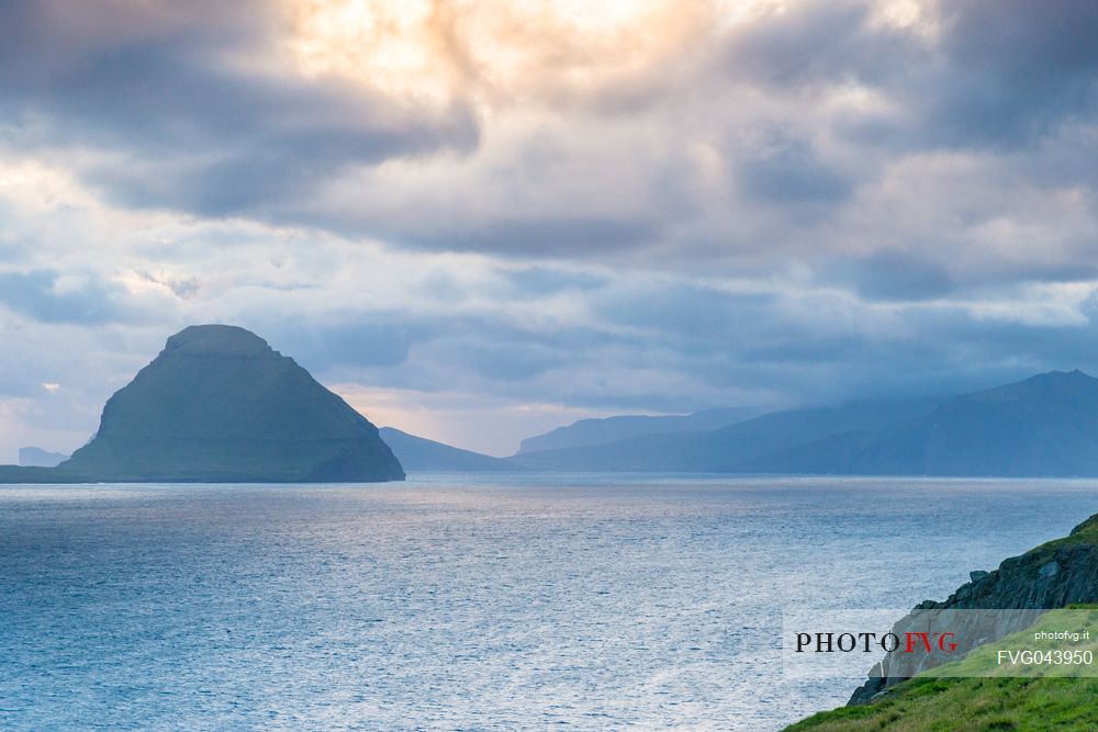 View of Koltur Island in a cloudy evening from Streymoy island, Faeroe islands, Denmark, Europe