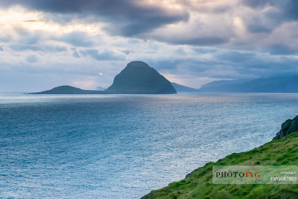 View of Koltur Island in a cloudy evening from Streymoy island, Faeroe islands, Denmark, Europe