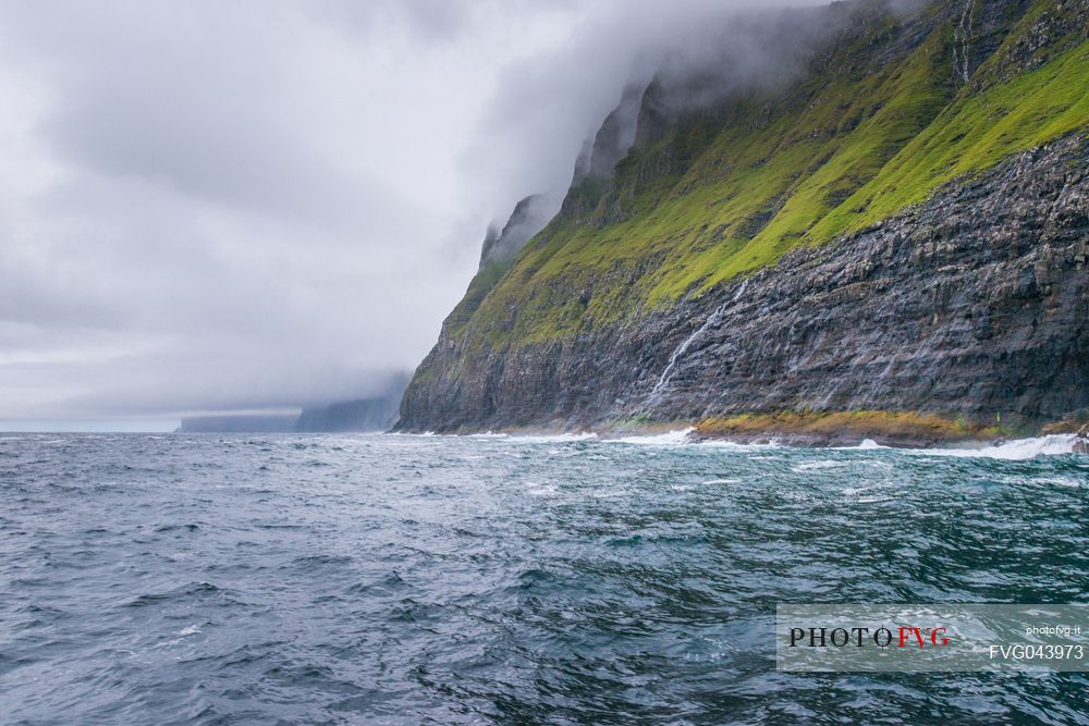 View from the sea of ​​the Vestmanna Sea Cliffs, Streymoy island, Faeroe islands, Denmark, Europe