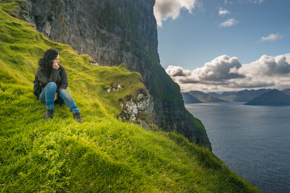 Tourist near Kallur Lighthouse close to Trllanes, Kalsoy Island (Kals), Faeroe Islands, Denmark, Europe