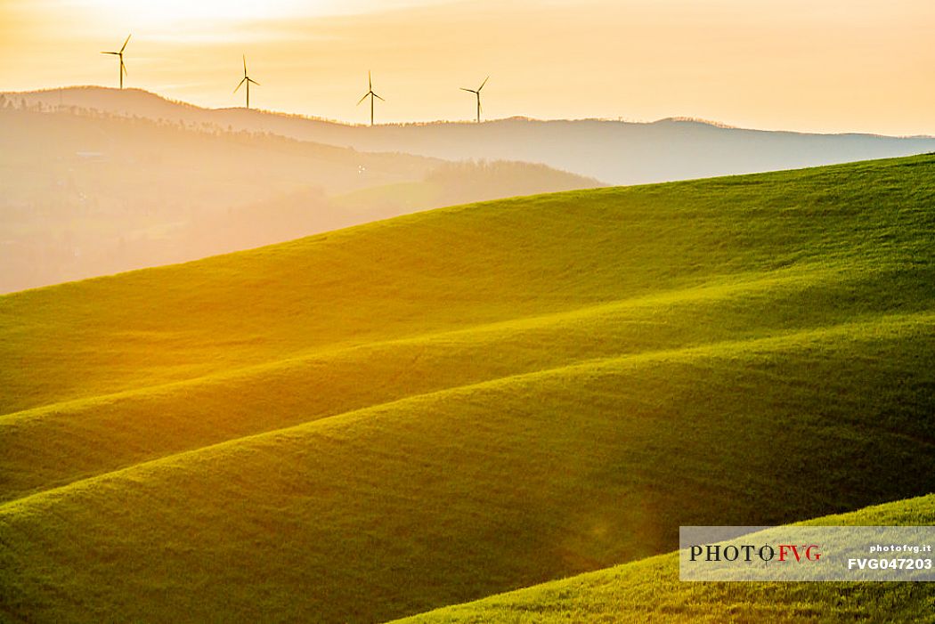 Wind turbines in the typical Tuscan landscape near Volterra, Tuscany, Italy, Europe