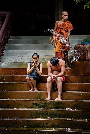 Buddhist monk blesses people