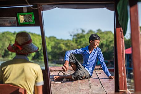 Young boy on a boat to Kompong Pluk