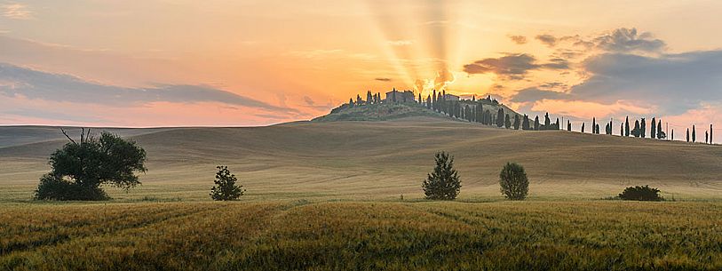 Farm in the Crete Senesi landscape at twilight, Orcia valley, Tuscany, Italy