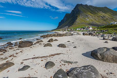 Norwegian beach with the remote coastal village of Vikten, Lofoten Islands, Norway